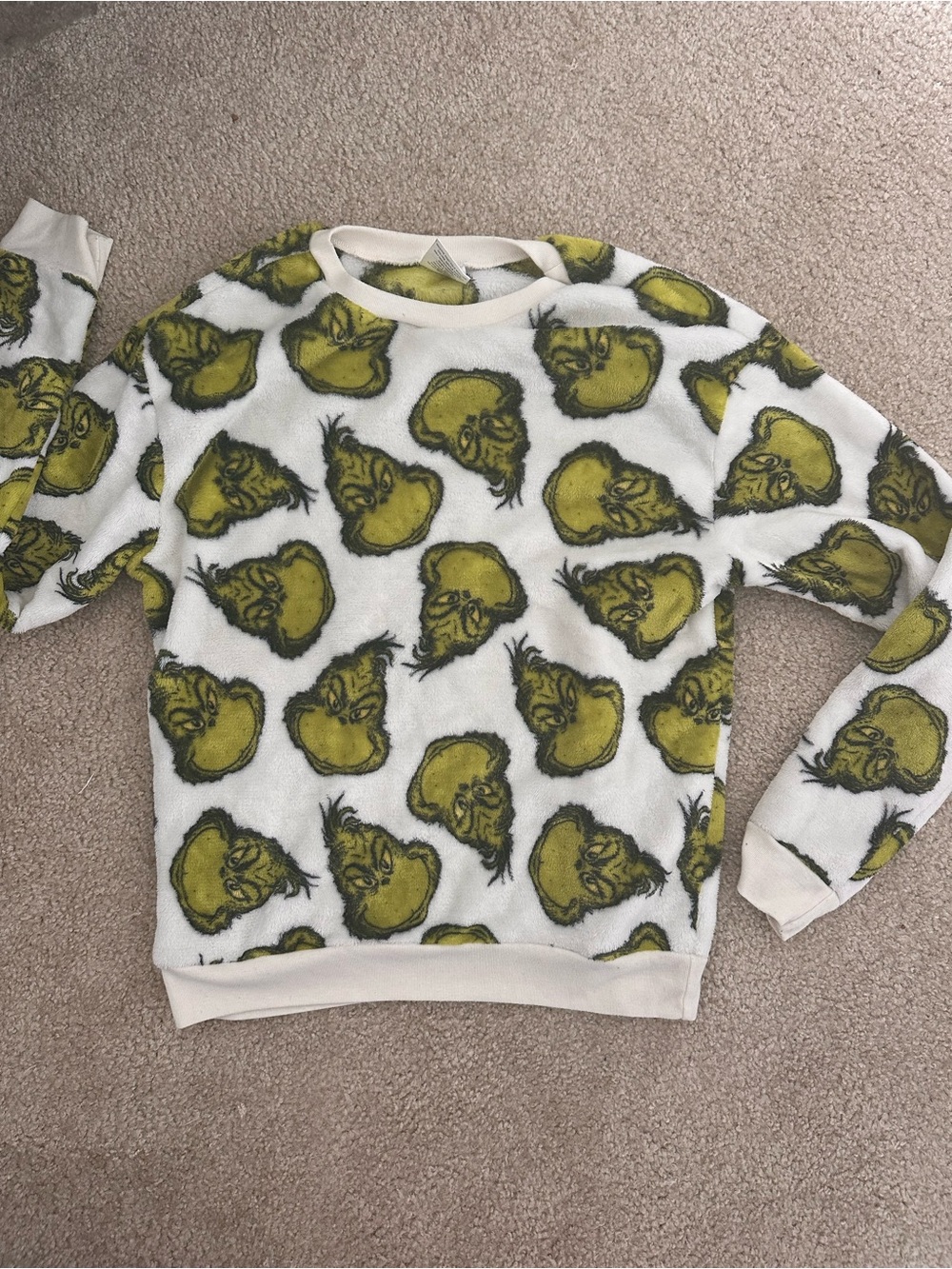 Grinch crewneck sweatshirt with repeating green Grinch faces